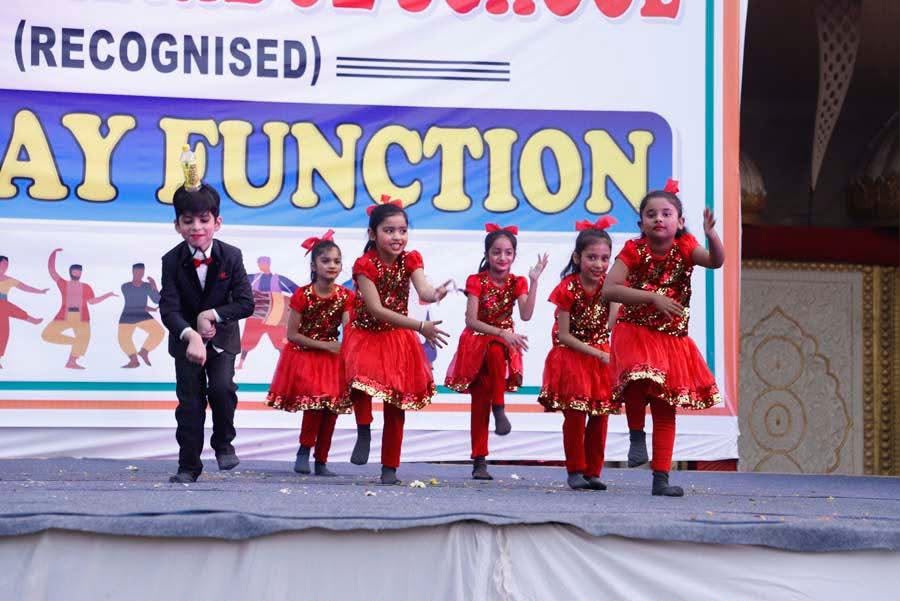 Young children performing a dance at the Annual Day function